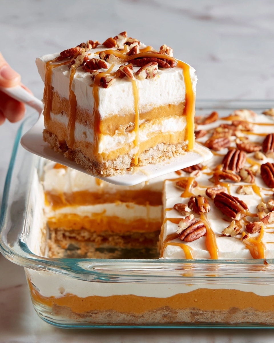 The image shows a square dessert with four layers in a clear glass dish, resting on a white marbled background. The bottom layer is a thick, smooth caramel-colored base, followed by a thin layer of cream with a light beige cookie or crust layer on top. Above that is another caramel layer, then a thick, fluffy white cream layer covers the entire top. The dessert is decorated with drizzled caramel sauce and scattered pecan halves on the white cream surface. A woman's hand is holding a slice of the dessert on a white spatula, revealing all the layers clearly. Photo taken with an iphone --ar 4:5 --v 7
