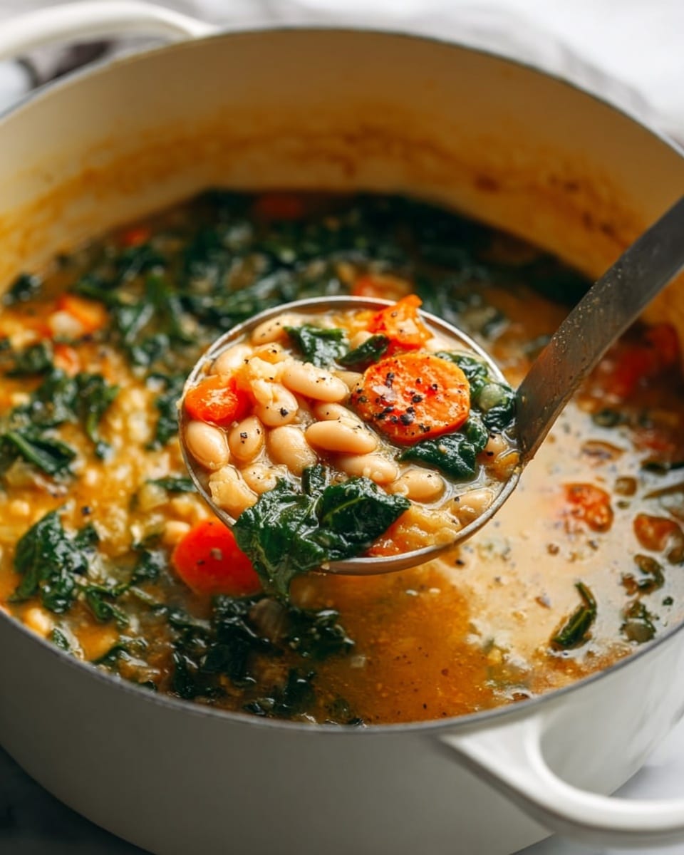A close-up of a large white pot filled with a thick soup showing layers of white beans, bright orange carrot slices, and dark green leafy greens all mixed in a rich, golden broth with visible black pepper specks. A metal ladle lifts a portion of the soup, displaying the chunky texture and colorful ingredients in the center of the image. The background features a soft, white marbled surface with natural light highlighting the freshness and warmth of the soup, photo taken with an iphone --ar 4:5 --v 7
