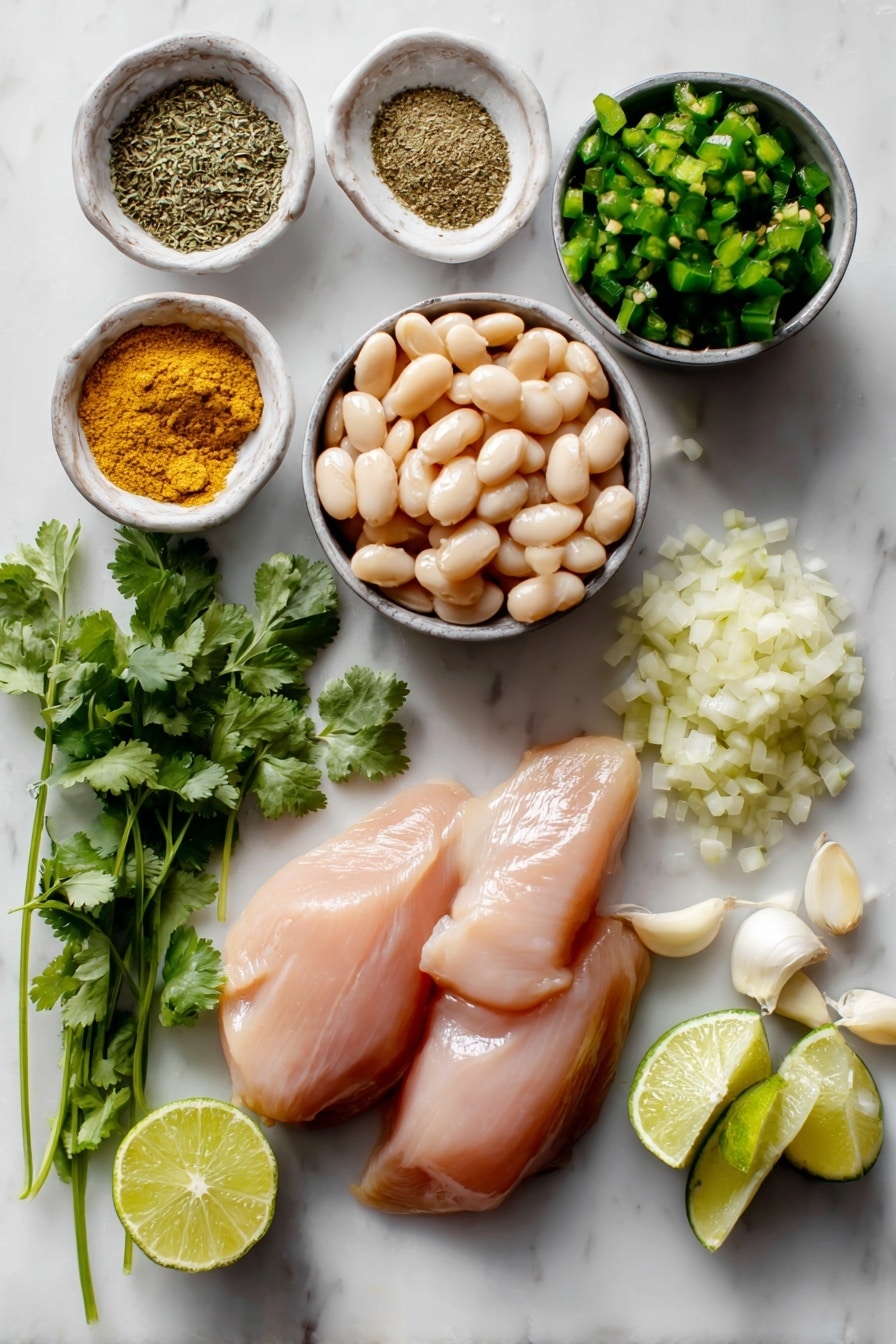 Flat lay of boneless skinless chicken breasts, cans of white beans with some beans spilled out, diced green chiles in a small heap, minced garlic cloves, finely diced yellow onion, fresh cilantro sprigs, fresh lime wedges cut in halves and quarters, and ground cumin and dried oregano sprinkled in small piles, all beautifully arranged on a white marble surface, photo taken with an iphone --ar 2:3 --v 7 - Crockpot White Chicken Chili, easy white chicken chili, crockpot chicken chili, creamy chicken chili recipe, healthy crockpot chili