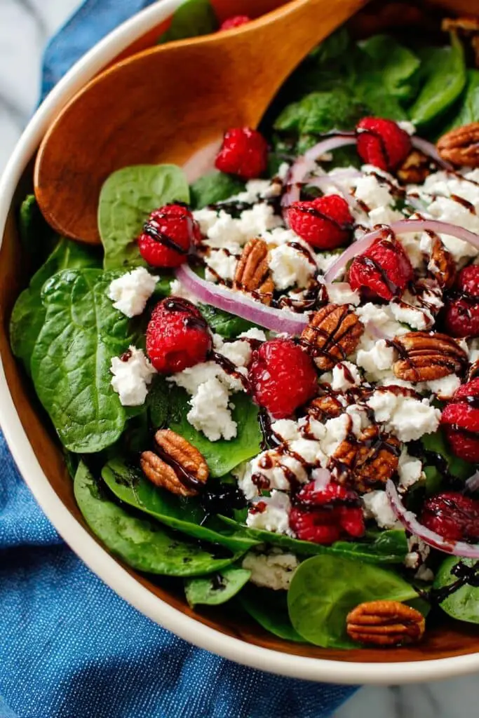 Mixed Spinach Salad with Goat Cheese, Raspberries, and Toasted Pecans Recipe