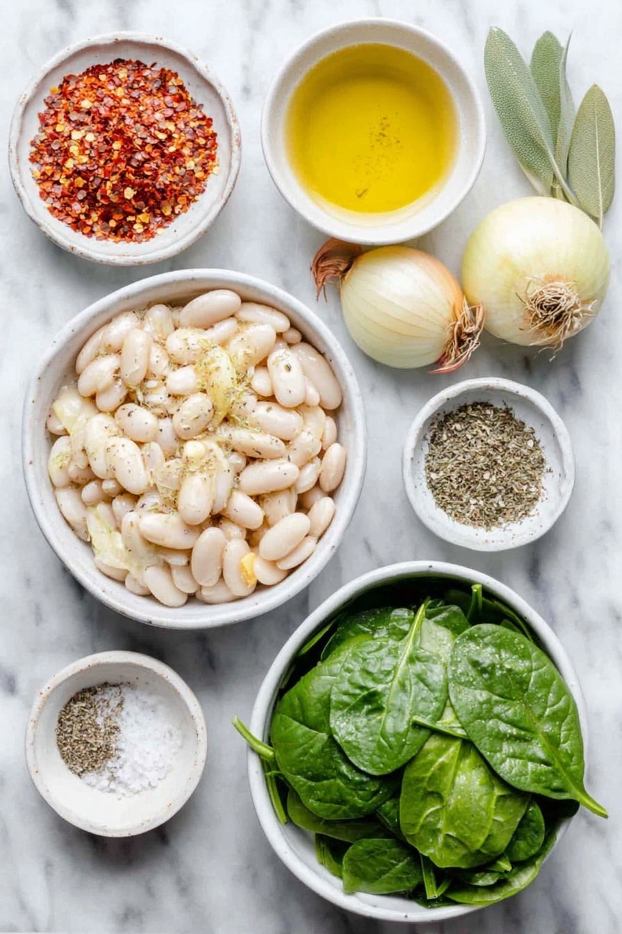 Flat lay of a small white ceramic bowl of extra virgin olive oil, a small peeled onion, two medium shallots with papery skins, four whole garlic cloves, two sliced carrots cut into coins, two diced celery stalks, a large white ceramic bowl of drained white cannellini beans, two fresh green bay leaves, a small white bowl of dried Italian seasoning herbs, a small white bowl of red pepper flakes, a large white ceramic bowl of fresh vibrant green spinach leaves, a small white bowl of coarse sea salt, and a small white bowl of ground black pepper all arranged symmetrically placed on a clean white marble surface, soft natural light, photo taken with an iPhone, professional food photography style, fresh ingredients, white ceramic bowls, no bottles, no duplicates, no utensils, no packaging --ar 2:3 --v 7 --p awthu7i m7354615311229779997 - Tuscan White Bean Soup, Italian White Bean Soup, hearty bean soup recipe, healthy vegetable soup, comforting Tuscan soup