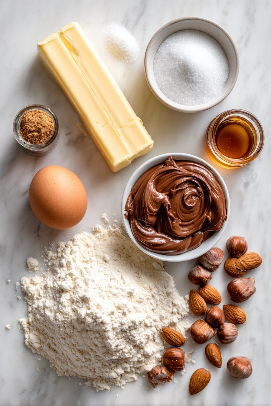 Flat lay of a stick of unsalted butter, a small pile of white sugar, a few spoonfuls of brown sugar, a single large egg, a small glass bottle of vanilla extract, a bowl of flour with visible texture, a dollop of smooth Nutella hazelnut spread, and a scattering of almond nuts, all beautifully arranged on a white marble surface, photo taken with an iphone --ar 2:3 --v 7 - Nutella Thumbprint Cookies, easy Nutella cookie recipe, chocolate filled cookies, buttery Nutella cookies, homemade Nutella thumbprint treats