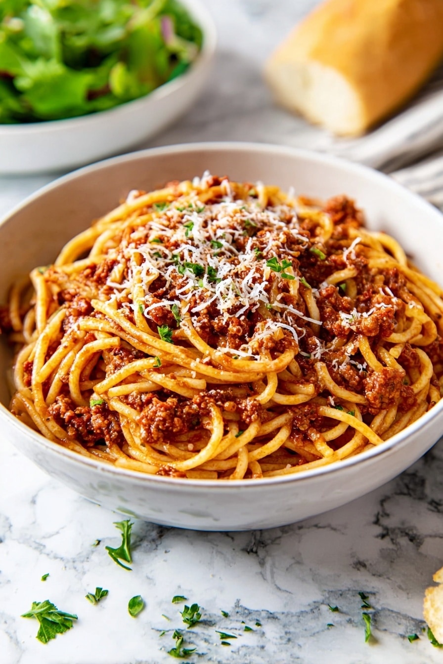 A white bowl filled with spaghetti covered in a rich, reddish-brown meat sauce. The spaghetti noodles are twisted around a silver fork held by a woman's hand above the bowl, showing the sauce and bits of meat clinging to the strands. Some grated cheese is sprinkled lightly over the top. In the blurry background, there is a piece of bread and a small bowl with green herbs on a white marbled surface. The overall scene is brightly lit and focuses closely on the forkful of spaghetti photo taken with an iphone --ar 2:3 --v 7 - Slow Cooker Bolognese Sauce, hearty pasta sauce, easy slow cooker recipes, meat sauce for pasta, Italian meat sauce