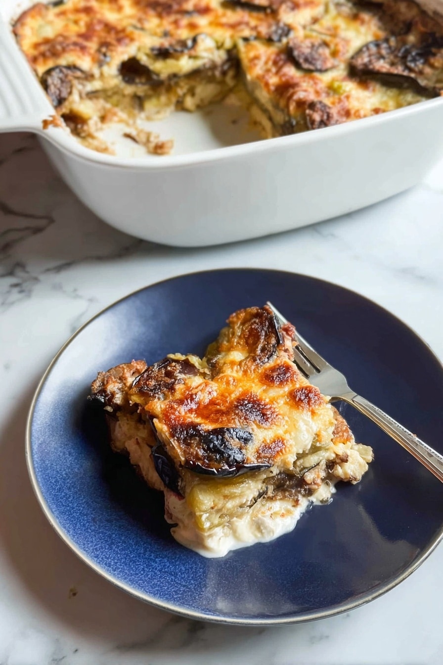 A white casserole dish sits in the background, filled with a baked layered dish that has a golden, slightly browned cheese crust with some darker browned spots, showing eggplant or similar vegetables beneath. In the foreground, a piece of this dish is served on a white plate, showing three visible layers: the top layer is melted golden cheese with some browned spots, the middle layer has slices of dark brown roasted eggplant, and the bottom layer is a white creamy base, possibly cheese or sauce. A fork rests on the plate next to the food. The background surface is a white marbled texture. Photo taken with an iphone --ar 2:3 --v 7 - Chicken Zucchini Bake, healthy chicken casserole, easy zucchini bake, protein-packed veggie bake, light comfort food