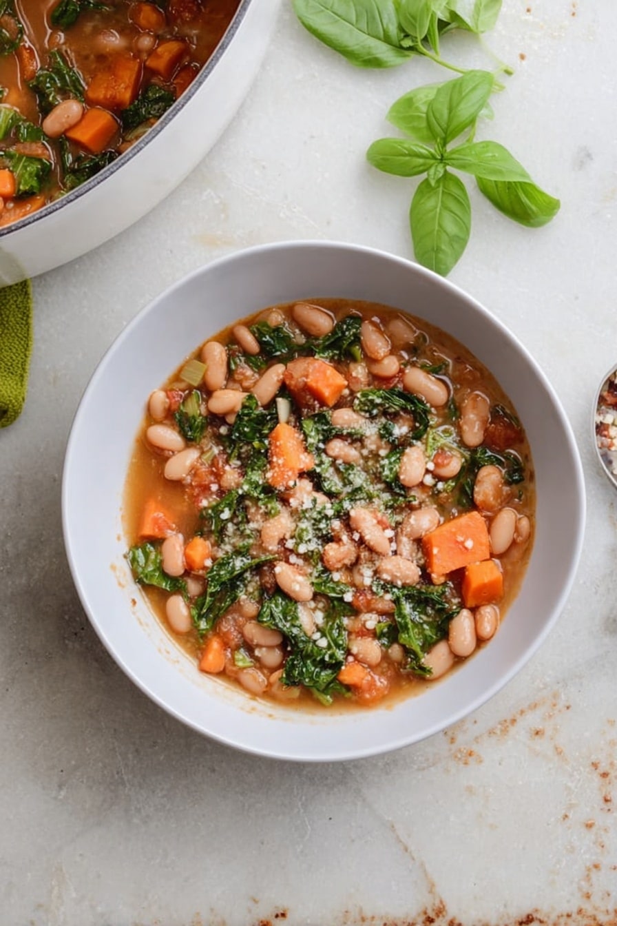 A white bowl filled with a stew made of light brown beans, bright orange carrot pieces, and green leafy vegetables in a light brown broth. Small white grains sprinkled on top add texture. To the top left, part of a white pot with the same stew is visible. Fresh green basil leaves lie beside the bowl on a white marbled surface with some scattered leaves and crumbs around it. photo taken with an iphone --ar 2:3 --v 7 - Cranberry Bean Soup, hearty bean soup recipe, comforting soup with cranberries, easy vegetarian soup, nourishing cranberry bean dish