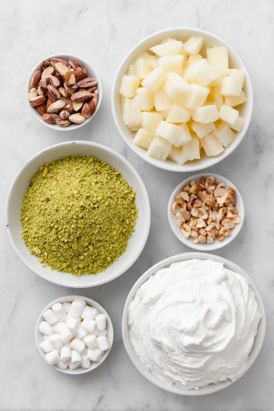 Flat lay of a small mound of bright green pistachio pudding powder, a simple white ceramic bowl filled with crushed pineapple chunks with juice, a small white bowl overflowing with white miniature marshmallows, scattered light brown chopped nuts, and a neat dollop of fluffy white whipped topping arranged on a simple white ceramic plate, all placed on a clean white marble surface, soft natural light, photo taken with an iPhone, professional food photography style, fresh ingredients, white ceramic bowls, no bottles, no duplicates, no utensils, no packaging --ar 2:3 --v 7 --p m7354615311229779997 - Easy Watergate Salad, Watergate Salad, vintage dessert, creamy fruit salad, no-bake dessert