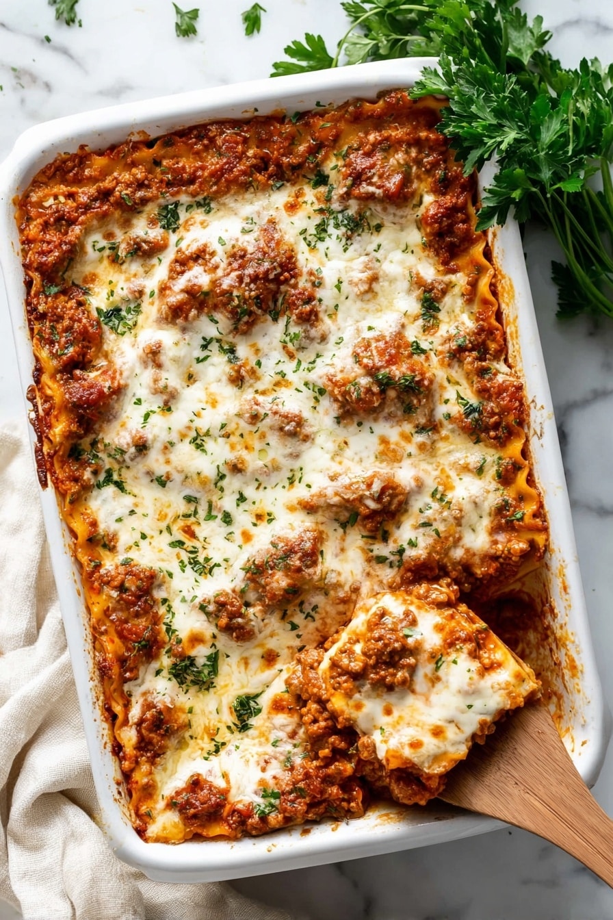 A close-up view of a lasagna dish inside a white baking dish, showing multiple layers of pasta, meat sauce, and melted white cheese on top. The top cheese layer is smooth and creamy with hints of browned spots and small green herb pieces sprinkled across. The meat sauce looks rich and chunky with a reddish-brown color mixed with bits of orange from melted cheese inside. A wooden spoon is lifting a portion, revealing several pasta sheets coated in sauce and melted cheese, with the woman's hand holding the spoon partly visible on the right side. The dish sits on a white marbled surface. photo taken with an iphone --ar 2:3 --v 7 - Baked Ravioli with Meat Sauce, baked ravioli casserole, Italian baked pasta, easy meat sauce pasta, cheesy baked ravioli