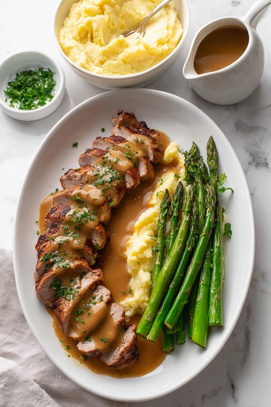 The image shows a white oval plate on a white marbled surface with sliced grilled meat arranged in two rows on the left side. The meat is covered with a smooth brown sauce and sprinkled with chopped green herbs. Next to the meat on the right side are several steamed asparagus spears that are bright green and glossy. Behind the meat and asparagus, there is a white bowl filled with creamy pale yellow mashed potatoes with a slightly uneven smooth surface. In the top left corner on the white marbled surface is a small white bowl with fresh chopped herbs. On the bottom right corner, a white pitcher contains more brown sauce, partially visible. The photo has soft lighting and a clean, fresh presentation style. Photo taken with an iphone --ar 2:3 --v 7 - Garlic Turkey Tenderloin with Easy Gravy, Turkey Tenderloin recipe, quick turkey dinner, flavorful turkey entrees, easy turkey recipes for weeknights