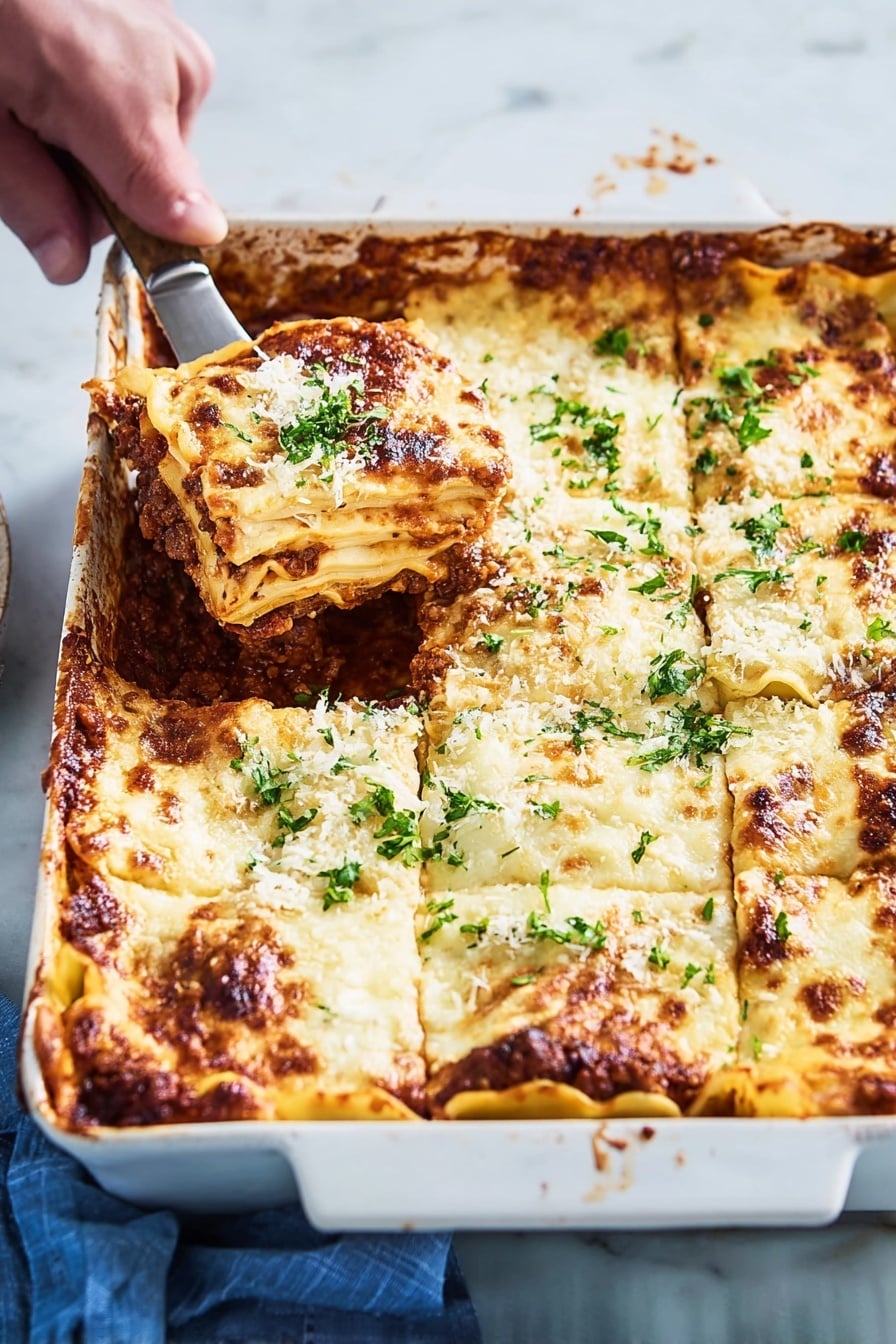 A white rectangular ceramic baking dish holds a layered lasagna with six visible sections. The top layer is melted, golden-brown cheese with some darker browned spots along the edges and sprinkled with fresh green parsley. Underneath the cheese, there are thick, creamy white sauce layers alternating with pasta sheets, visible along the edges where the cheese has browned. Between the pasta layers, a rich dark brown meat sauce with a slightly chunky texture peeks through the sides. A woman's hand is holding a spatula lifting one lasagna piece from the top left corner, showing the thick layers clearly. The dish rests on a white marbled surface with a blue cloth partially visible on the side photo taken with an iphone --ar 2:3 --v 7 - Zucchini Lasagna with Meat Sauce, healthy zucchini lasagna, low-carb zucchini lasagna, easy zucchini lasagna recipe, cheesy zucchini lasagna