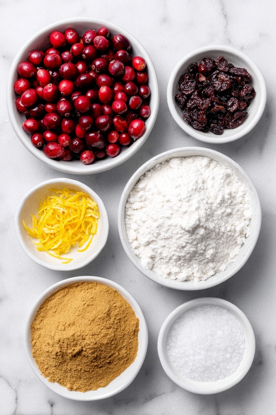 Flat lay of a small mound of fresh bright red cranberries, a small white ceramic bowl filled with fine white granulated sugar, a few strips of fresh orange zest curled gently, a small white bowl of deep golden ground cinnamon powder, a small white bowl of warm brown ground ginger powder, a small white bowl of fine white cornstarch powder, a small white bowl with freshly squeezed orange juice showing a vibrant orange color, a small white bowl containing coarse kosher salt crystals placed symmetrically—all items arranged with perfect balance and fresh natural appearance, placed on a clean white marble surface, soft natural light, photo taken with an iPhone, professional food photography style, fresh ingredients, white ceramic bowls, no bottles, no duplicates, no utensils, no packaging --ar 2:3 --v 7 --p m7354615311229779997 - Cranberry Pie with Orange and Spices, festive cranberry pie, holiday fruit pie, easy cranberry dessert, spiced fruit pie