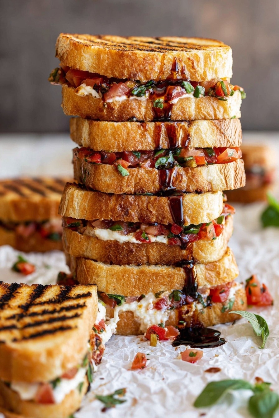 A tall stack of grilled sandwiches with four layers of golden toasted bread, each layer filled with finely chopped red tomatoes, green herbs, and melted light cream cheese, with dark brown balsamic glaze drizzled over the top and sides. The sandwiches show clear grill marks and are placed on crumpled white parchment paper with scattered bits of tomato and herbs around, on a white marbled surface. To the side, a single smaller sandwich with the same fillings is laid down, showing the textured toasted bread and filling clearly. Some green leaves are visible in the foreground. photo taken with an iphone --ar 2:3 --v 7 - Bruschetta Grilled Cheese Sandwiches, Italian-inspired grilled cheese, easy bruschetta sandwich recipe, crispy ciabatta grilled cheese, tomato basil grilled cheese