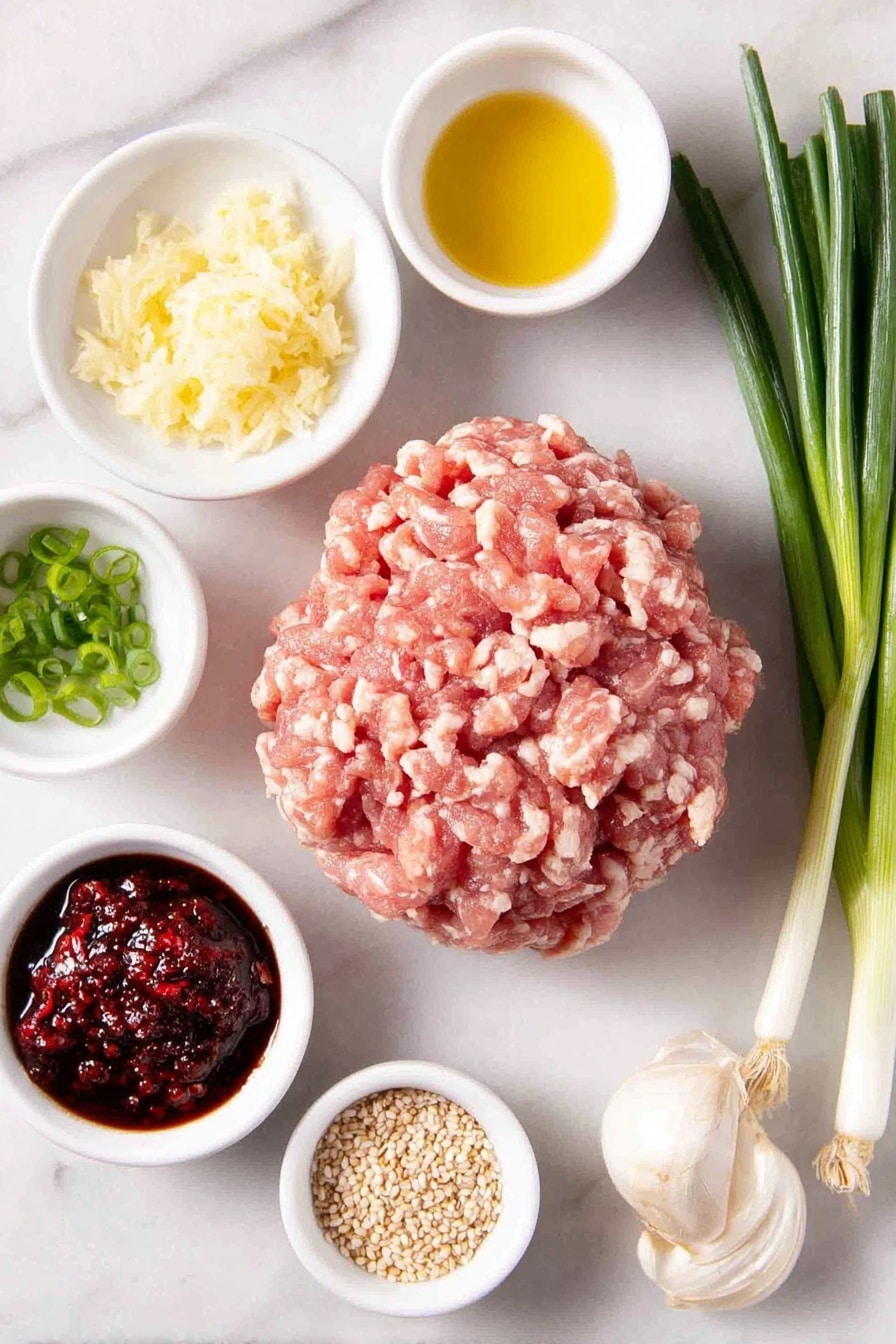 Flat lay of a mound of fresh ground chicken showing light and dark meat, a small bunch of whole scallions with green and white parts, a small white bowl with freshly grated ginger and juice, a small white bowl with grated garlic cloves, two small white bowls each containing gluten-free tamari sauce, a small white bowl with golden avocado oil, a few thinly sliced scallions arranged neatly, a small white bowl with rich red chili sambal, a small white bowl with toasted sesame seeds, all balanced symmetrically and placed on a clean white marble surface, soft natural light, photo taken with an iPhone, professional food photography style, fresh ingredients, white ceramic bowls, no bottles, no duplicates, no utensils, no packaging --ar 2:3 --v 7 --p m7354615311229779997 - Asian Chicken Meatballs, Asian Chicken Meatballs recipe, easy Asian chicken meatballs, healthy chicken meatballs, flavorful Asian meatballs
