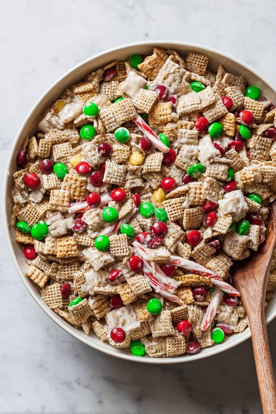 A large white bowl filled with a colorful snack mix showing a mix of light brown square cereal pieces, white-coated sticks, and red and green candy-coated chocolates scattered evenly throughout. The texture is crunchy with clusters of cereal and white coating binding some pieces together. A light brown wooden spoon is partially buried inside the mix on the right side of the bowl. The bowl sits on a white marbled surface. photo taken with an iphone --ar 2:3 --v 7 - Chex Christmas Mix, Holiday Snack Recipes, Easy Christmas Treats, Sweet and Salty Snacks, Festive Party Snacks