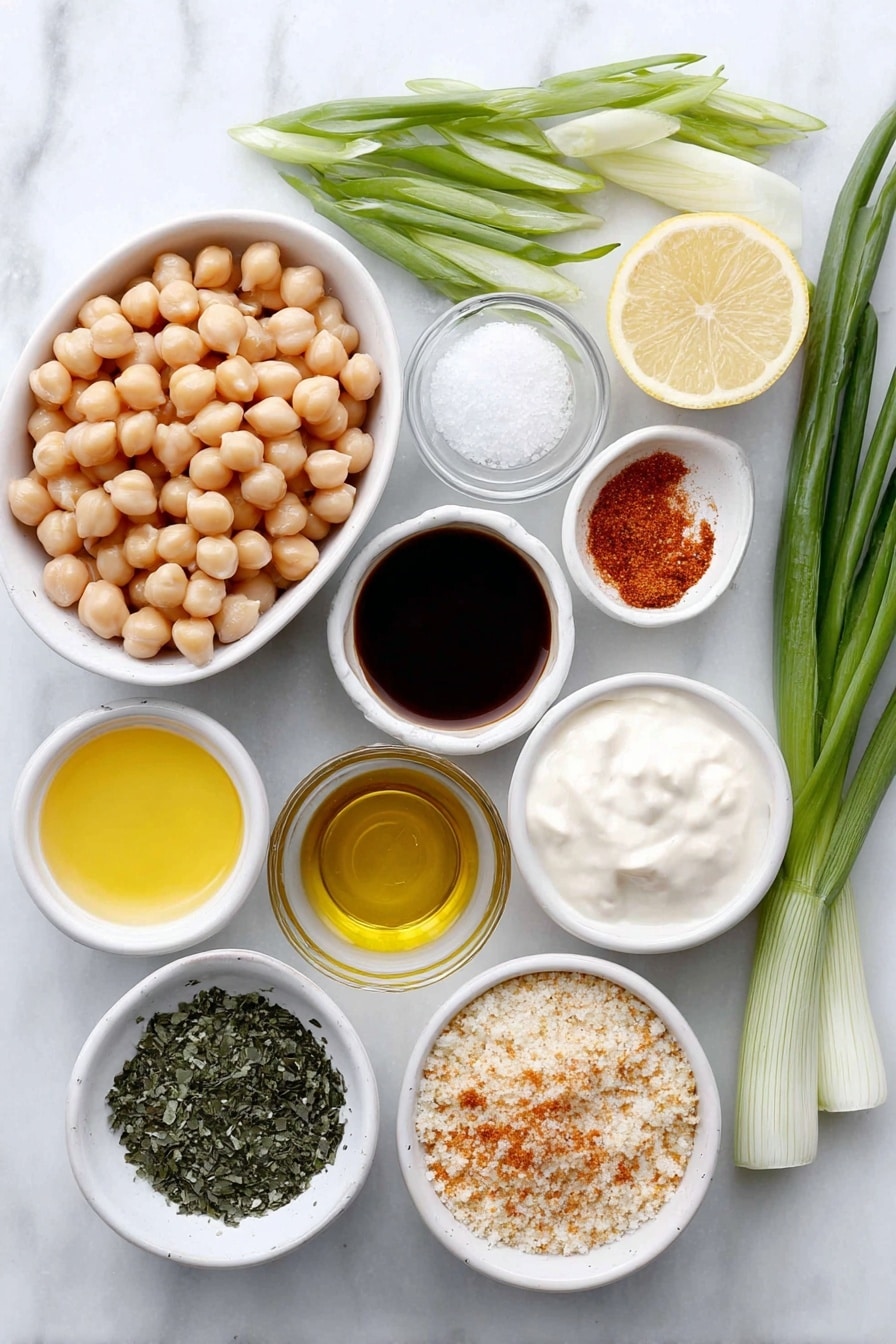 Flat lay of whole garbanzo beans in a pile, fresh hearts of palm stalks halved lengthwise, a small white ceramic bowl of reserved garbanzo bean liquid foamy, a small white ceramic bowl of creamy vegan mayonnaise, a small white ceramic bowl of bright yellow lemon juice, a small white ceramic bowl of deep brown vegan Worcestershire sauce, a small white ceramic bowl of smooth Dijon mustard, fresh green onions sliced, a small white ceramic bowl of dark green kelp granules, dried bright green parsley flakes, vibrant reddish-orange Old Bay seasoning powder, coarse sea salt crystals, granulated garlic powder, a small white ceramic bowl filled with light golden breadcrumbs, a small white ceramic bowl of pale golden oil, arranged with perfect symmetry and balanced proportions, placed on a clean white marble surface, soft natural light, photo taken with an iPhone, professional food photography style, fresh ingredients, white ceramic bowls, no bottles, no duplicates, no utensils, no packaging --ar 2:3 --v 7 --p m7354615311229779997 - Hearts of Palm Crab Cakes, plant-based crab cakes, vegan seafood alternative, easy crab cake recipe, healthy crab cake recipe