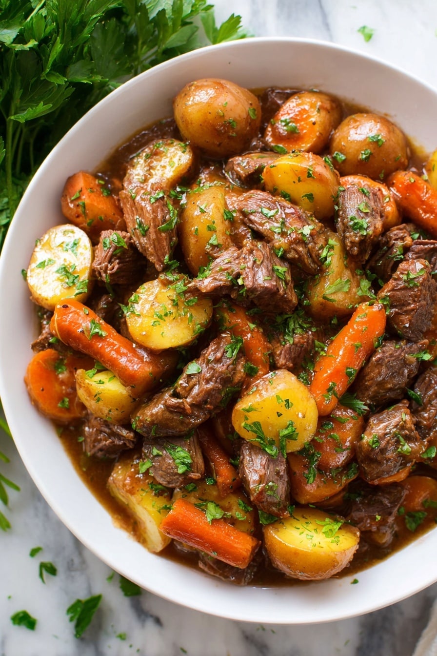 A white bowl filled with a hearty stew made of layers of chunky pieces of tender brown meat, round golden-yellow potatoes cut into halves, and thick orange carrot pieces. The ingredients are coated in a glossy brown sauce, and small green parsley leaves are sprinkled on top and around the dish for color. The bowl sits on a white marbled surface, with a bunch of fresh parsley placed beside it, partially visible in the corner. The scene is well-lit and the textures of the meat, vegetables, and sauce are clear and inviting photo taken with an iphone --ar 2:3 --v 7 - Slow Cooker Pot Roast, best pot roast recipe, easy beef roast, tender slow cooker beef, comforting dinner idea