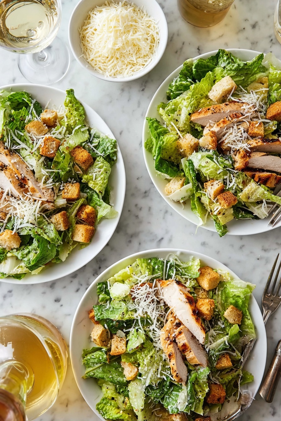 The image shows three white plates filled with a salad made of green romaine lettuce leaves as the base layer, topped with sliced grilled chicken pieces that have a light brown outside, scattered with golden brown croutons, and sprinkled with finely shredded white cheese. The plates are arranged on a white marbled surface alongside a small white bowl filled with more shredded cheese and a glass of light-colored liquid. A woman's hand is pouring a light yellow dressing from a bottle near the bottom left corner. photo taken with an iphone --ar 2:3 --v 7 - Ultimate Chicken Caesar Salad with Homemade Croutons, Chicken Caesar Salad, Homemade Caesar Dressing, Fresh Chicken Salad, Easy Caesar Salad