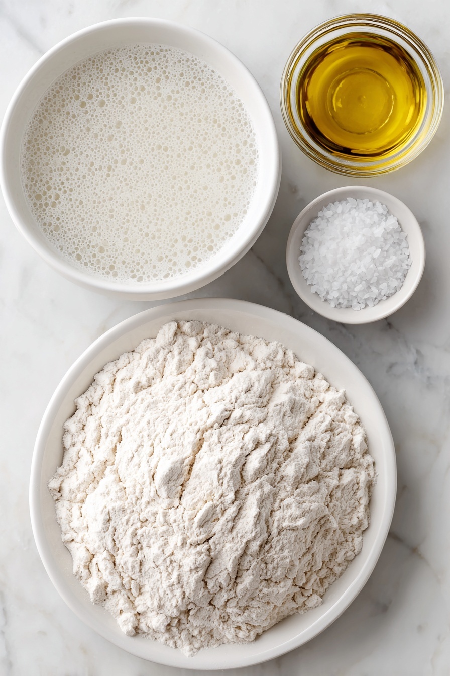 Flat lay of a small white ceramic bowl filled with bubbly, active sourdough starter, a larger white ceramic bowl of warm clear water, a neat mound of unbleached bread flour on a simple white ceramic plate, and a small white ceramic bowl containing fine sea salt crystals, all arranged in perfect symmetry and balanced proportions, placed on a clean white marble surface, soft natural light, photo taken with an iPhone, professional food photography style, fresh ingredients, white ceramic bowls, no bottles, no duplicates, no utensils, no packaging --ar 2:3 --v 7 --p m7354615311229779997 - Homemade Sourdough Bread, sourdough bread recipe, crusty sourdough loaf, easy sourdough baking, homemade bread instructions