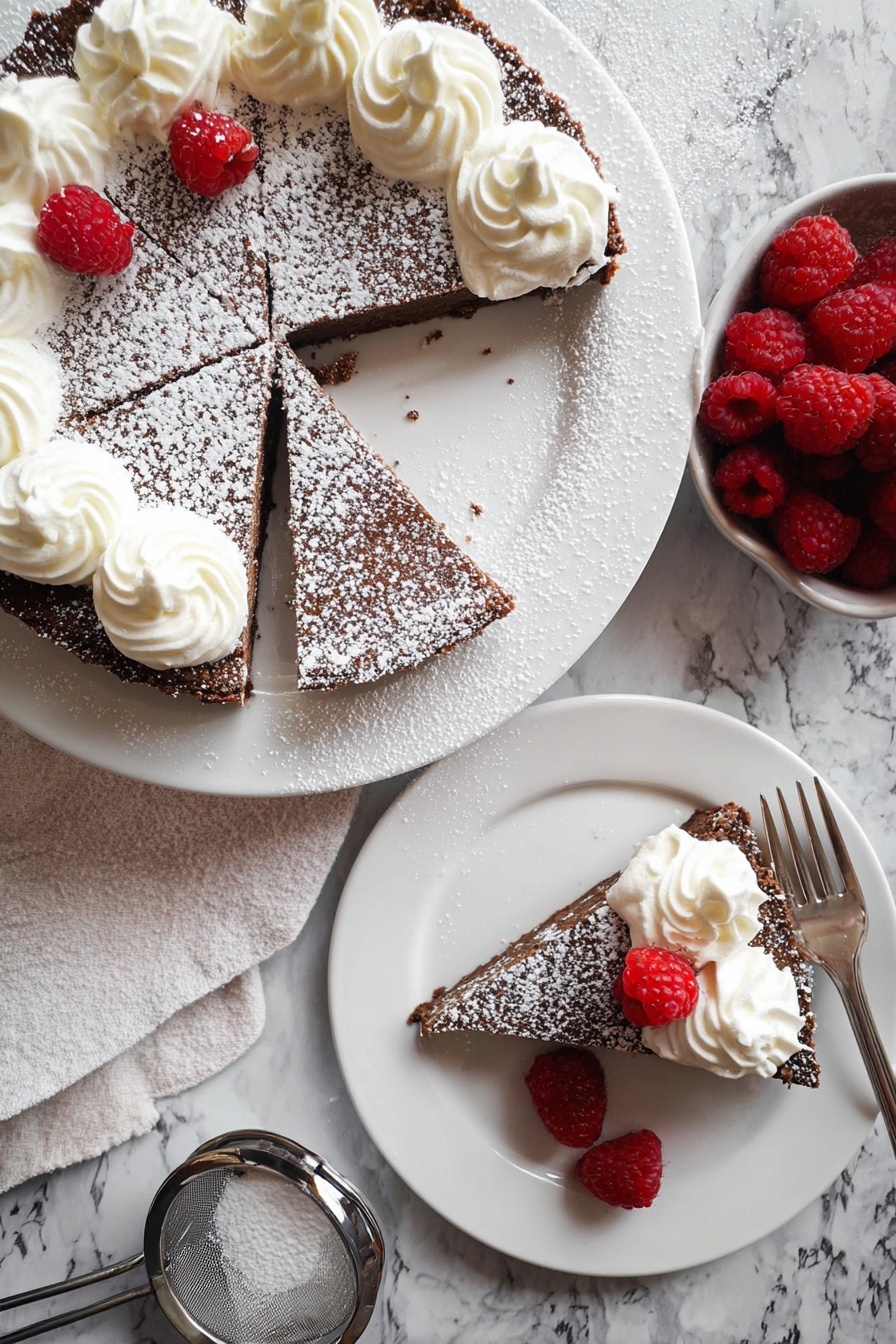 The image shows a chocolate tart with a dusting of powdered sugar on top served on a white plate, cut into pieces and decorated with swirls of white whipped cream along half of the tart’s top edge. Two slices are placed on separate white plates, each slice topped with whipped cream and accompanied by three raspberries dusted with powdered sugar. The tart’s rich, dark brown textured crust contrasts with the smooth creamy topping and bright red raspberries. The plates rest on a white marbled surface alongside a small bowl of fresh raspberries and a metal sieve with powdered sugar. Photo taken with an iphone --ar 2:3 --v 7 - Chocolate Raspberry Torte, Chocolate Raspberry Torte with Whipped Cream, decadent raspberry chocolate dessert, elegant chocolate berry dessert, easy raspberry chocolate cake